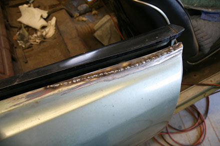 Passenger side GTO quarter reveal patch welded in