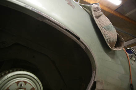 Metal removed on 67 GTO quarter panel wheel lip and primed