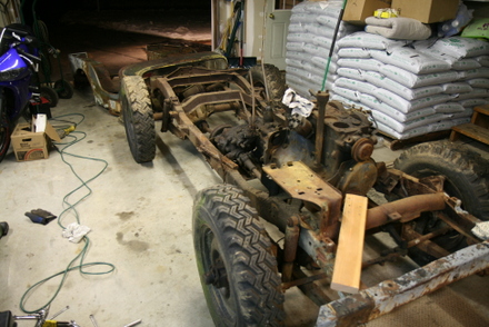 Body tub removed from frame 1950 Willys CJ3a Jeep