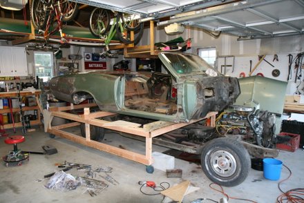 1967 GTO convertible body coming off the frame