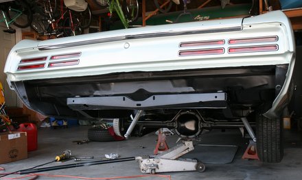 Repaired rear axle assembly being installed into 67 GTO convertible