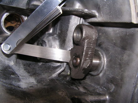 Using shim stock to "shoehorn" the reverse lever over the detent spring ball bearing